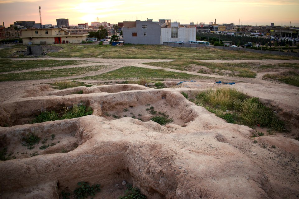 Views of pottery sherds, previous excavation sites, and the mound itself at 'Kelik Mishik' archaeological mound in Erbil 09