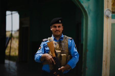 Views of Shia Kurdish police officer at the Shia shrine of Zakr Al-Deen in Shingal in April of 2019, following its destruction by the Islamic State 42