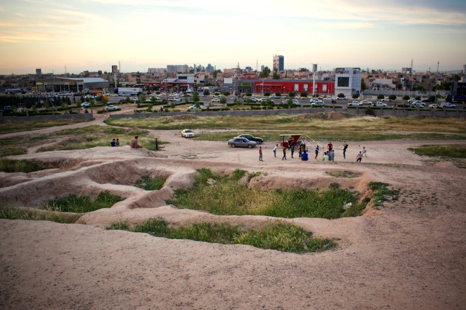 Views of pottery sherds, previous excavation sites, and the mound itself at 'Kelik Mishik' archaeological mound in Erbil 12