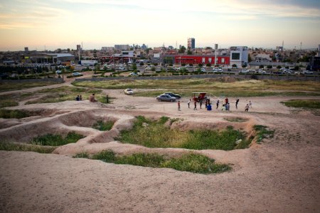 Views of pottery sherds, previous excavation sites, and the mound itself at 'Kelik Mishik' archaeological mound in Erbil 12