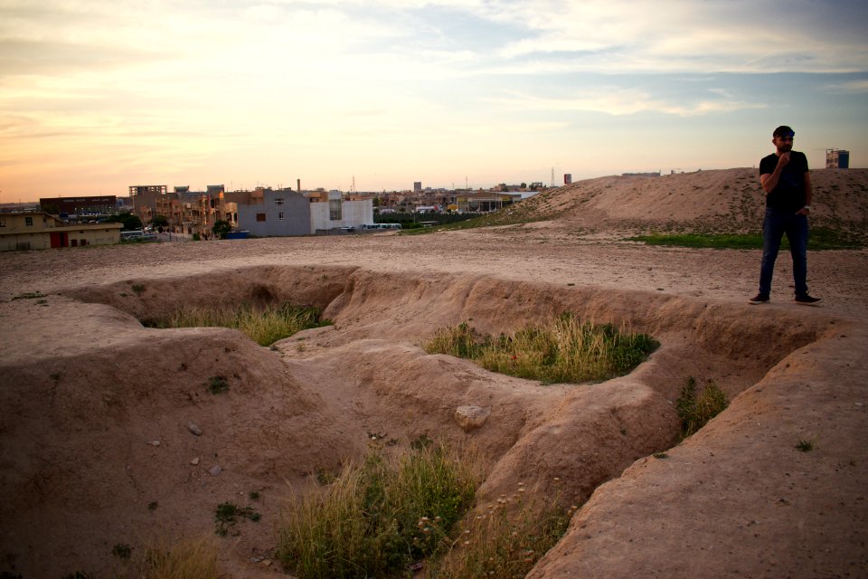 Views of pottery sherds, previous excavation sites, and the mound itself at 'Kelik Mishik' archaeological mound in Erbil 01