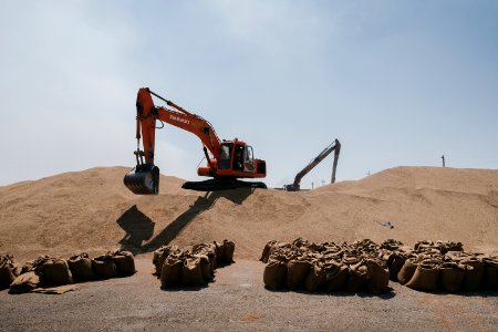 Views of the governmental grain depot in summer of 2019 in Shingal where Ezidi laborers are packing grain 04