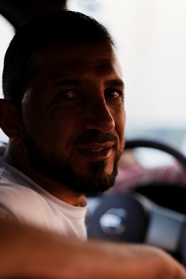 View of Ezidi man driving a car in Sinjar at sunset - 15
