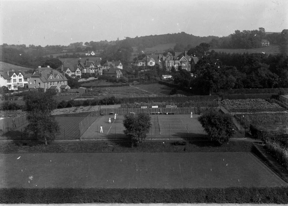 View of unidentified village with tennis courts and allotments (1294427)