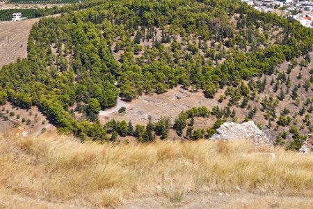 View of the remains of the sanctuaries of Apollo Deiradiotis and Athena Oxyderkes from Larissa Castle on September 5, 2020