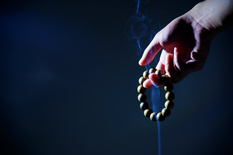Buddhist prayer beads smoke zen