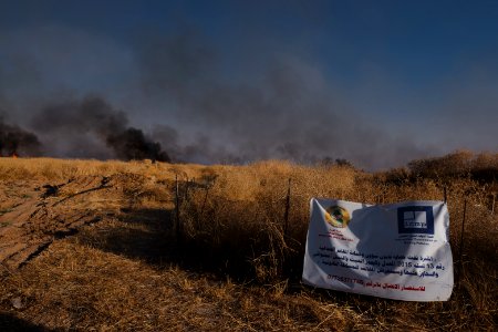 Views of the site of a massacre by the Islamic State and mass grave of Ezidis in Shingal (Sinjar) in summer of 2019 as field fires approach the location 07