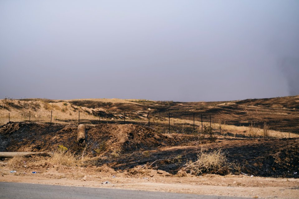 Views of the mass grave at a crossroads near Sinjar town where Ezidis were massacred, now an Iraqi police checkpoint 08