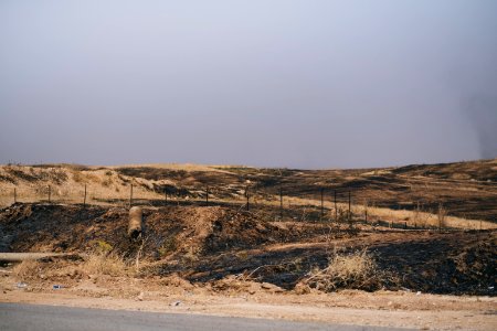 Views of the mass grave at a crossroads near Sinjar town where Ezidis were massacred, now an Iraqi police checkpoint 08