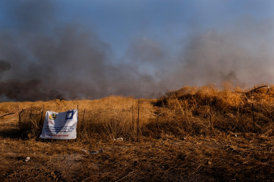 Views of the site of a massacre by the Islamic State and mass grave of Ezidis in Shingal (Sinjar) in summer of 2019 as field fires approach the location 08