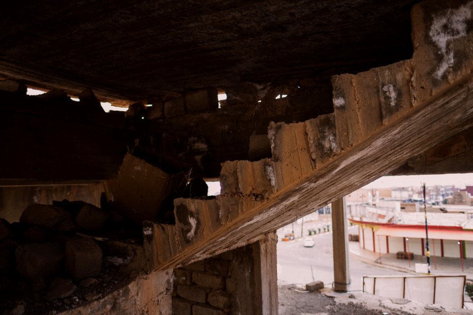 Views on 28th June 2019 around the destroyed city center of Shingal while a field fire rages south of the city 26
