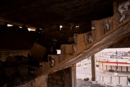 Views on 28th June 2019 around the destroyed city center of Shingal while a field fire rages south of the city 26
