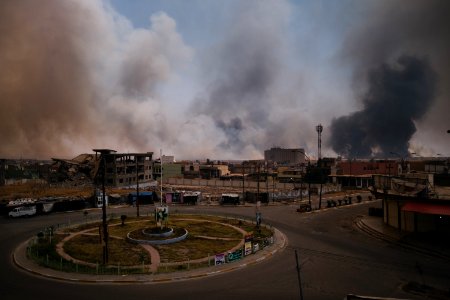Views on 28th June 2019 around the destroyed city center of Shingal while a field fire rages south of the city 23