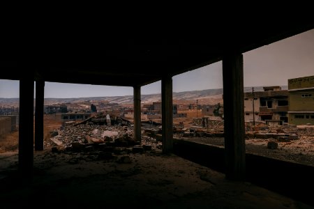 Views on 28th June 2019 around the destroyed city center of Shingal while a field fire rages south of the city 06