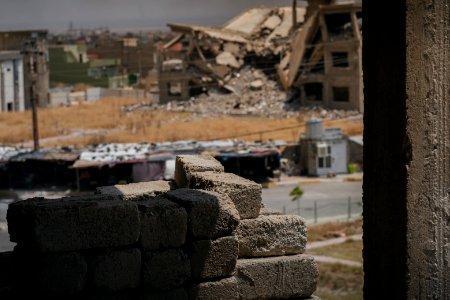 Views on 28th June 2019 around the destroyed city center of Shingal while a field fire rages south of the city 22