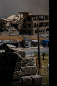 Views on 28th June 2019 around the destroyed city center of Shingal while a field fire rages south of the city 20
