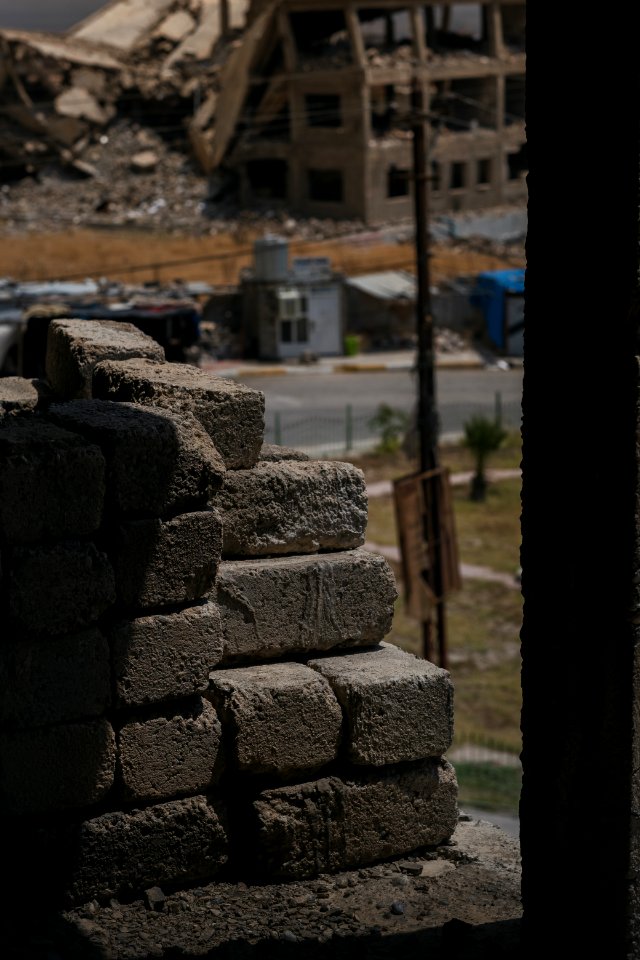 Views on 28th June 2019 around the destroyed city center of Shingal while a field fire rages south of the city 21