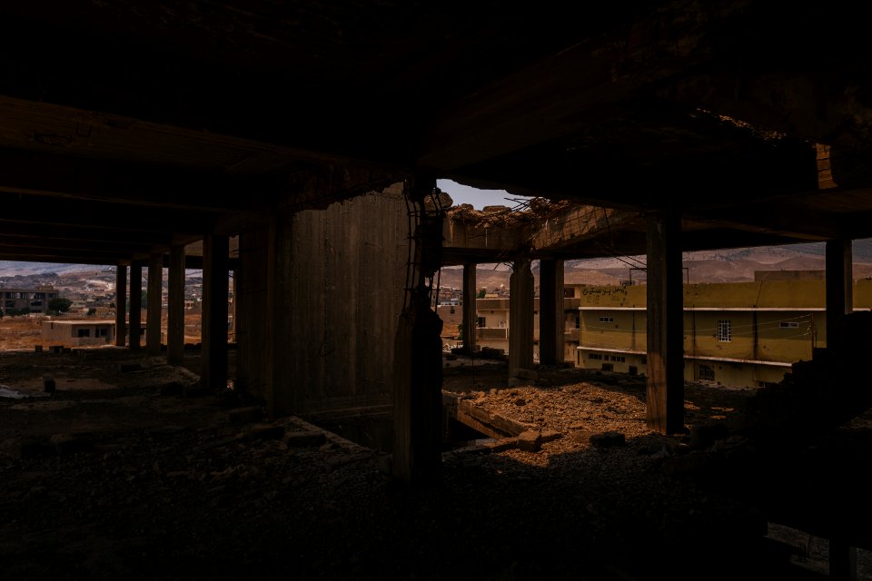 Views on 28th June 2019 around the destroyed city center of Shingal while a field fire rages south of the city 08