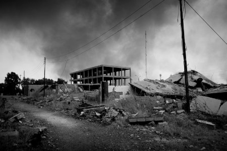 Views on 28th June 2019 around the destroyed city center of Shingal while a field fire rages south of the city 31