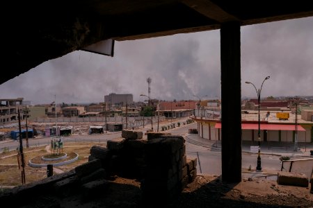 Views on 28th June 2019 around the destroyed city center of Shingal while a field fire rages south of the city 10