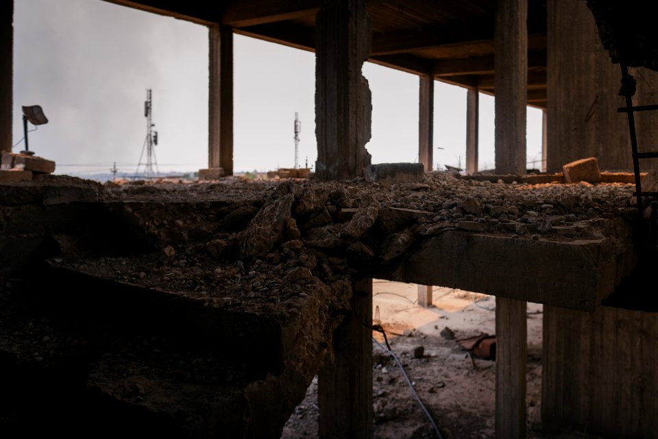 Views on 28th June 2019 around the destroyed city center of Shingal while a field fire rages south of the city 07