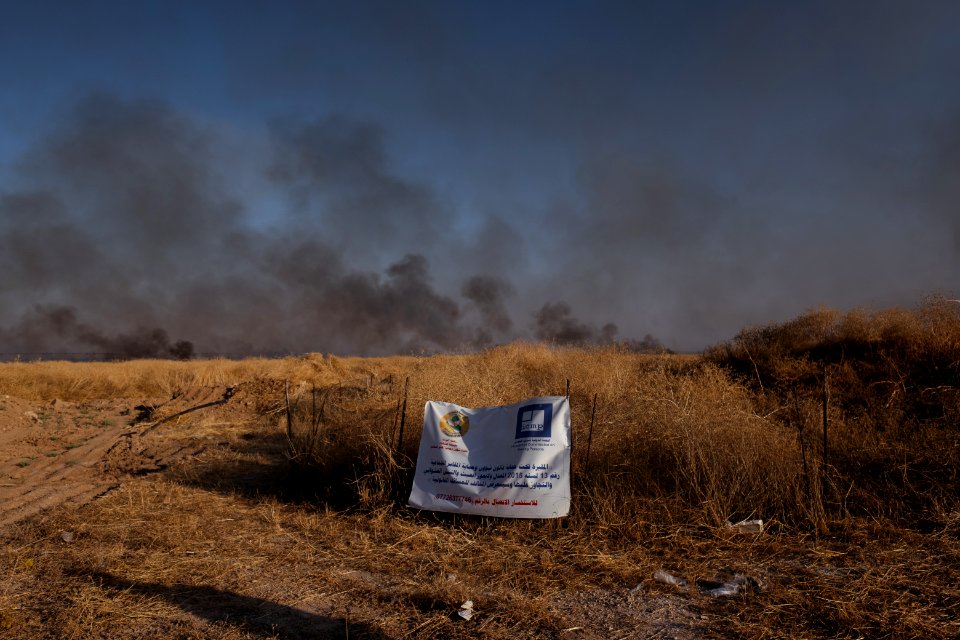 Views of the site of a massacre by the Islamic State and mass grave of Ezidis in Shingal (Sinjar) in summer of 2019 as field fires approach the location 05
