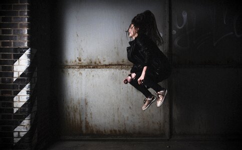 Girl alone jump photo