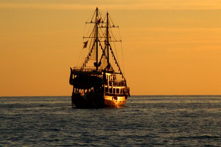 Ship sunset ocean photo