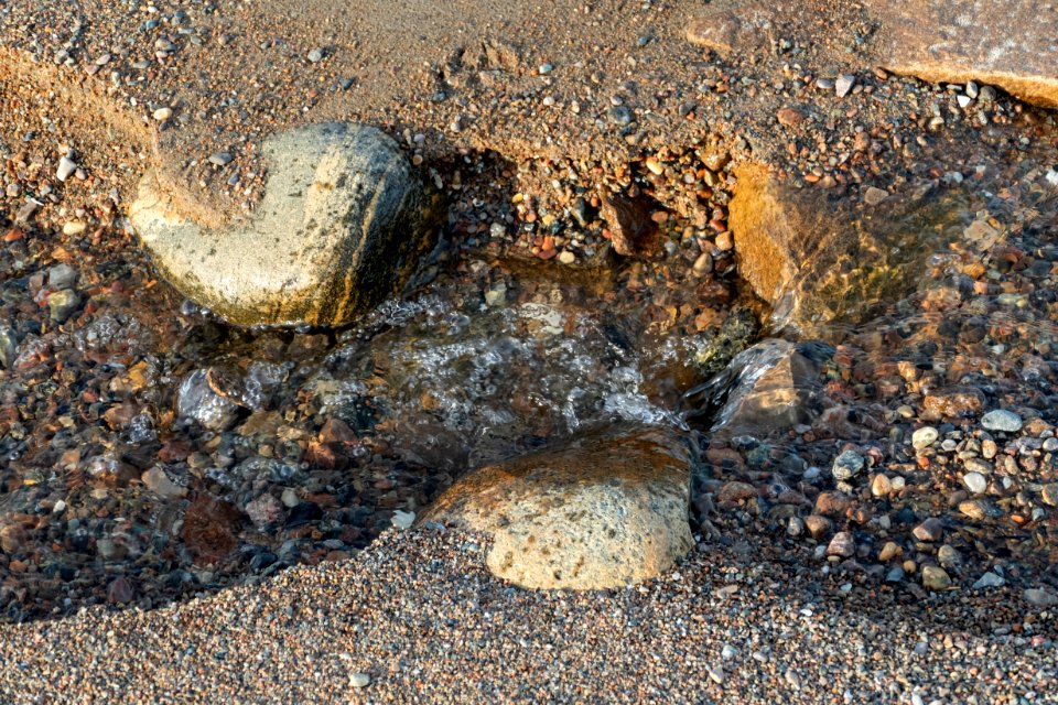 Water running through the sand at Fiskebäcksvik beach