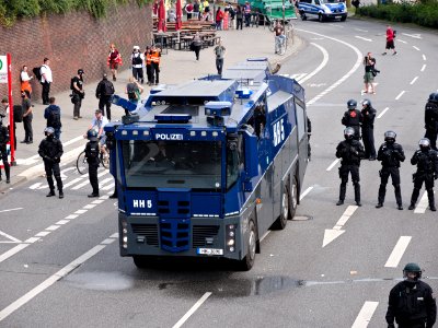 Water cannons next to the Landungsbrücken during G20 summit Hamburg 06 photo