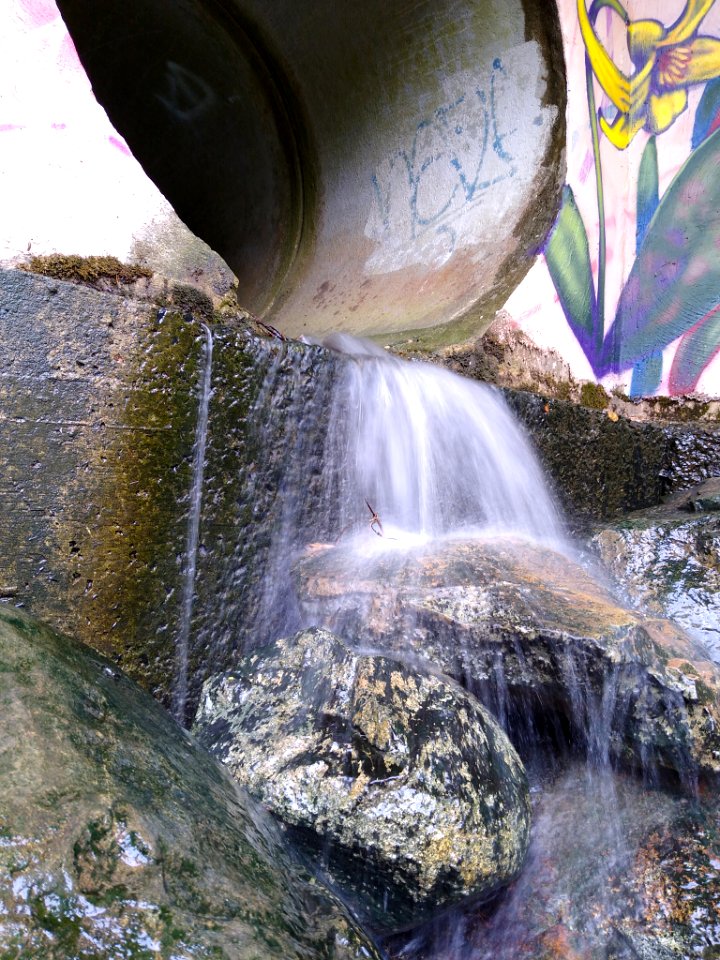 Water flowing out of a drainage pipe in Chapel Hill