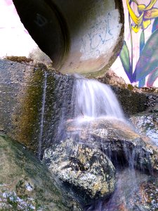 Water flowing out of a drainage pipe in Chapel Hill