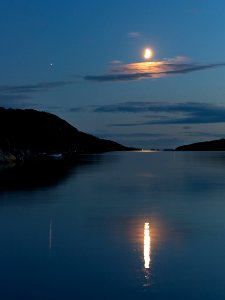 Waxing half moon over Brofjorden 2 photo