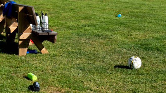Water bottles and a ball during soccer practice