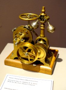 Water wheel governor, patented July 14, 1868 by H. D. Snow, made by the The Enos Adams Company, Bennington VT, cast iron, steel, brass, wood base - Bennington Museum - Bennington, VT - DSC09128 photo