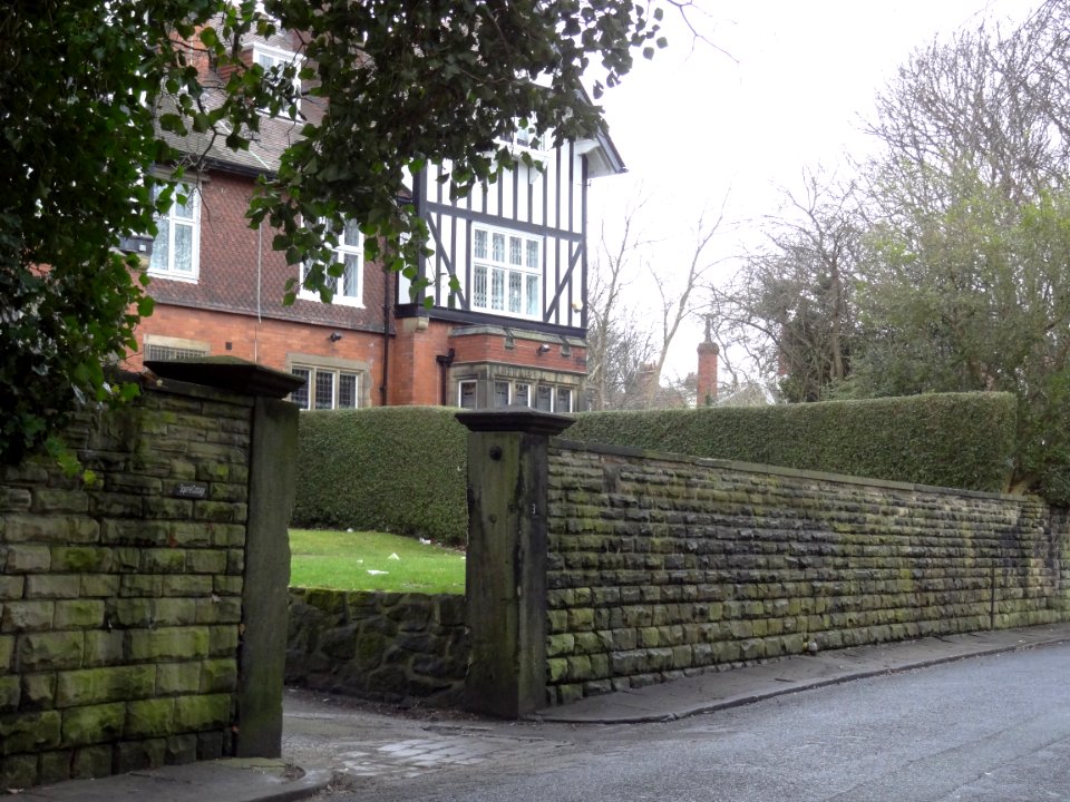 Wall, gate piers and gate with overthrow to Holmfield