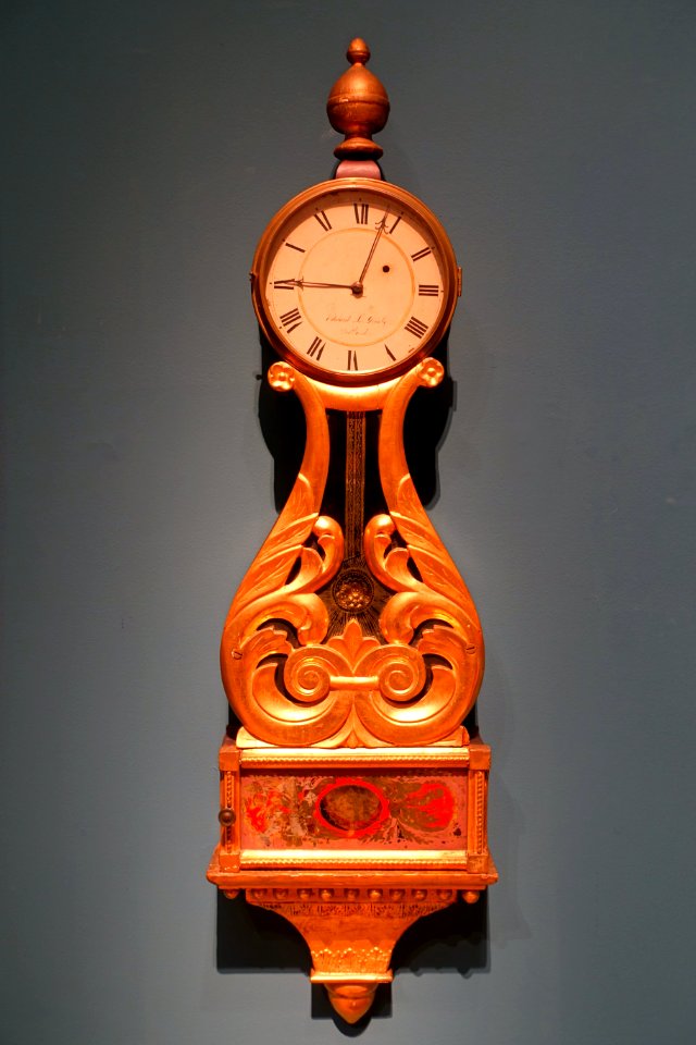 Wall clock by Edward Grueby, Portland ME, c. 1830-1839, pine, brass, gilt, verre eglomise - Portland Museum of Art - Portland, Maine - DSC04034