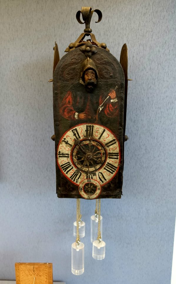 Wall clock with illustration of a sundial maker, Southern Germany, c. 1570, iron, oak - Germanisches Nationalmuseum - Nuremberg, Germany - DSC03748