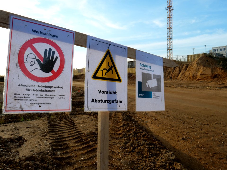 Warning signs at open pit mine Hambach