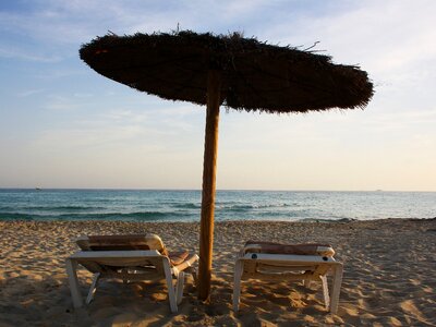 Waves beach umbrella chairs photo