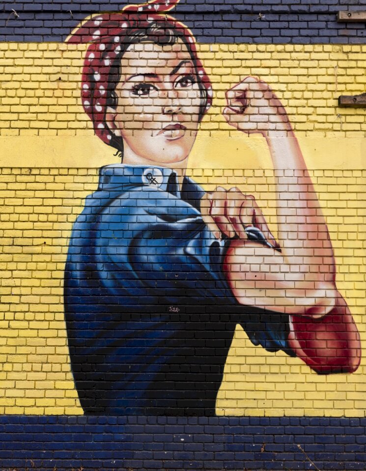 Rosie the riveter symbol icon