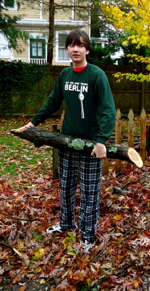 Volunteers assist with tree removal at neighbors house after Hurricane Sandy