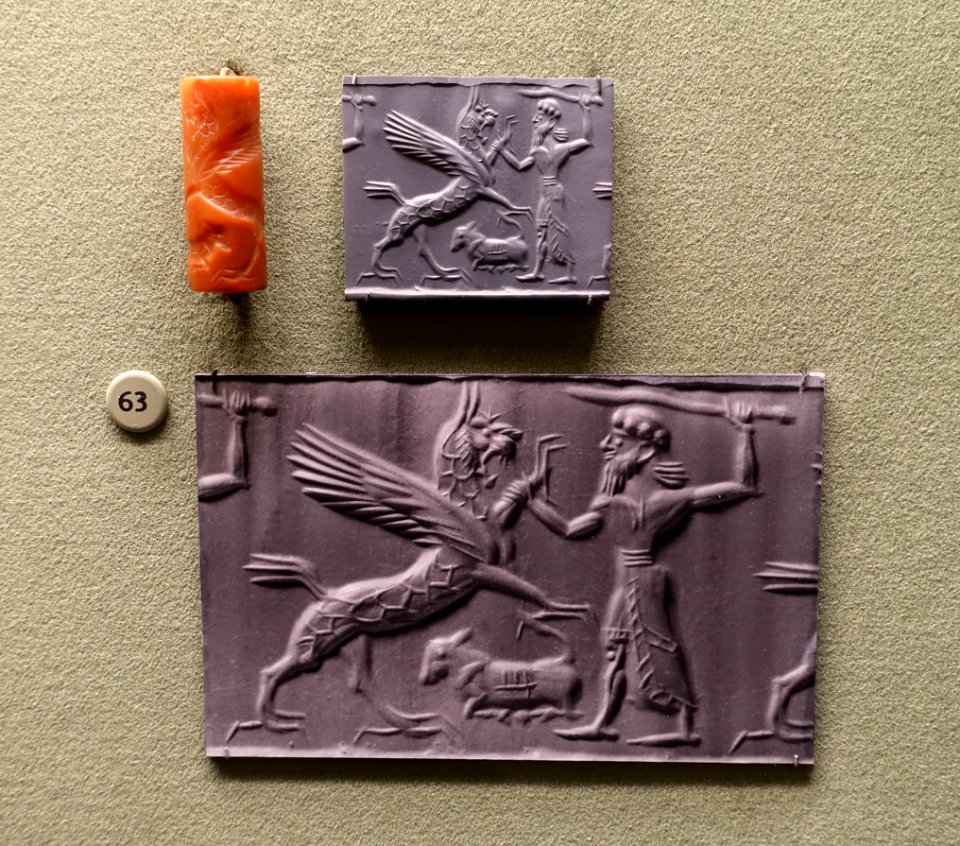 Winged lion griffin attacked by hero over kneeling calf, Mesopotamia, Middle Assyrian period, c. 12th-11th century BC, carnelian cylinder seal - Morgan Library & Museum - New York City - DSC06608
