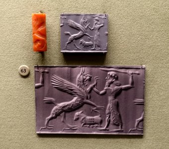 Winged lion griffin attacked by hero over kneeling calf, Mesopotamia, Middle Assyrian period, c. 12th-11th century BC, carnelian cylinder seal - Morgan Library & Museum - New York City - DSC06608