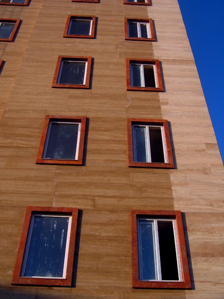 Windows of new apartment under construction - - near nishapur local government building and Simorgh culture house - at morning 4