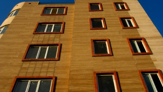 Windows of new apartment under construction - - near nishapur local government building and Simorgh culture house - at morning 1
