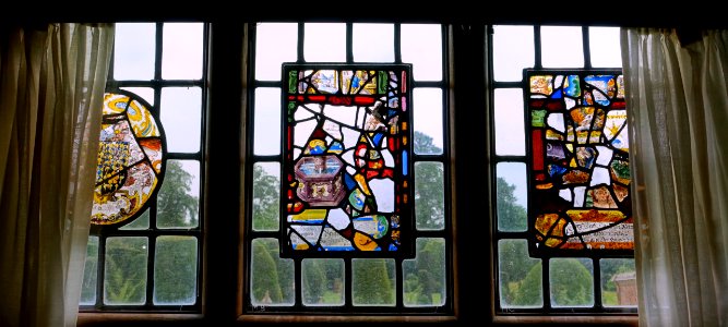 Window panels, unknown date (right) and 1613 (center and left), stained glass - Packwood House - Warwickshire, England - DSC08957