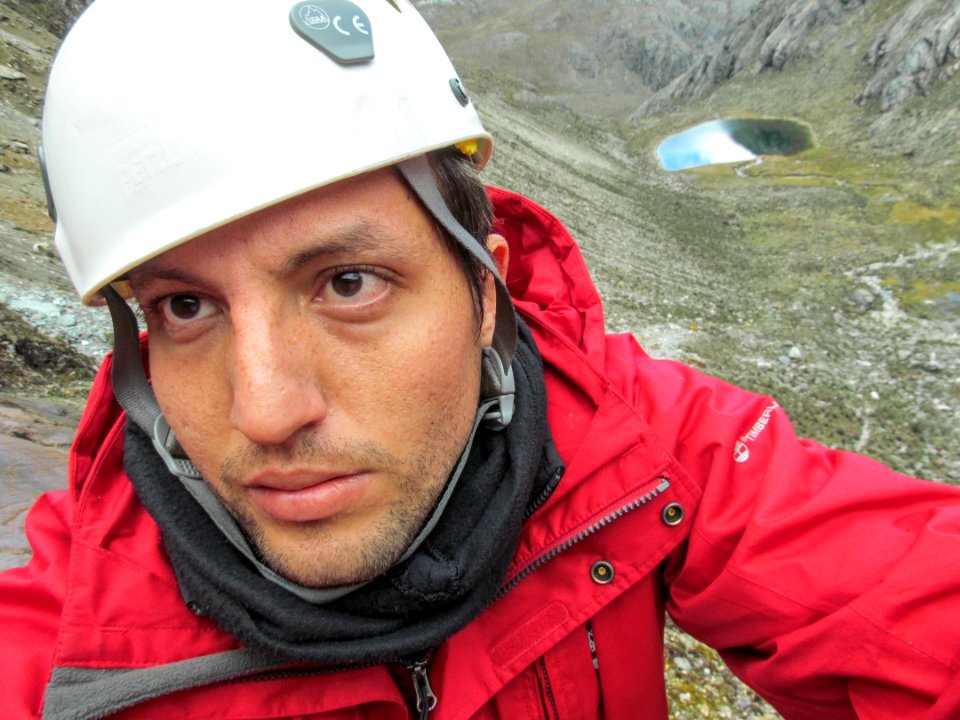 Wilfredor User climbing moraines, El Suero Lagoon back