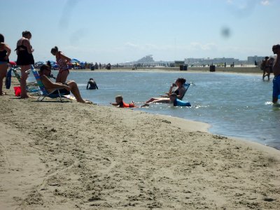 Wildwood New Jersey beach scene with kids playing in the tidal pool