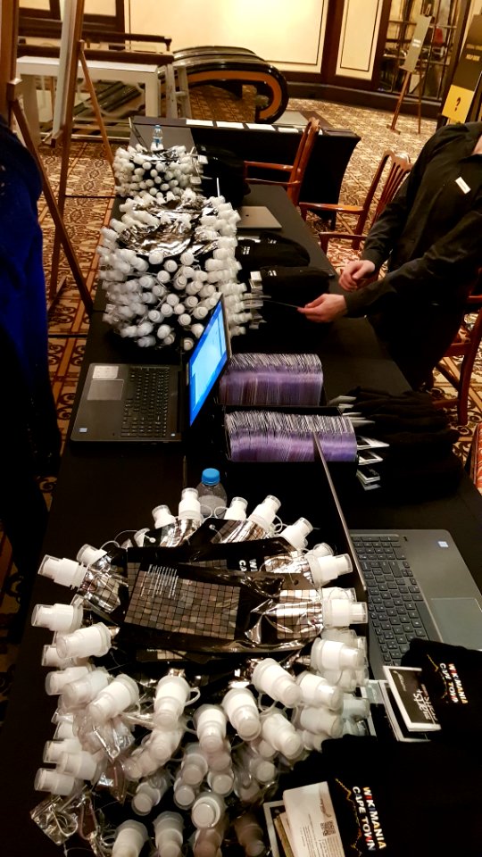 Wikimania 2018 - waterbottles at the registration desk
